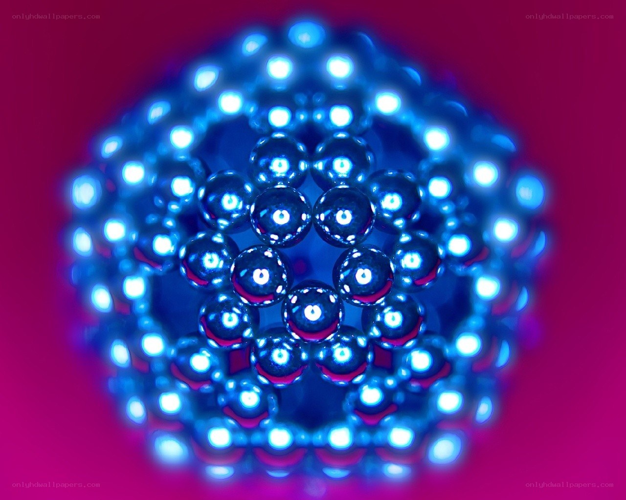 Blue magnetic spheres forming a sphere
