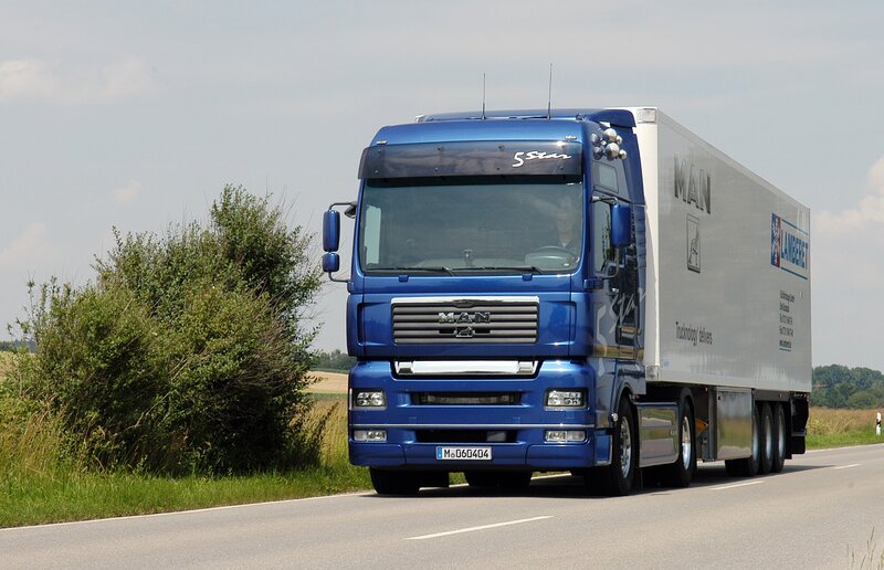 blue man truck on highway