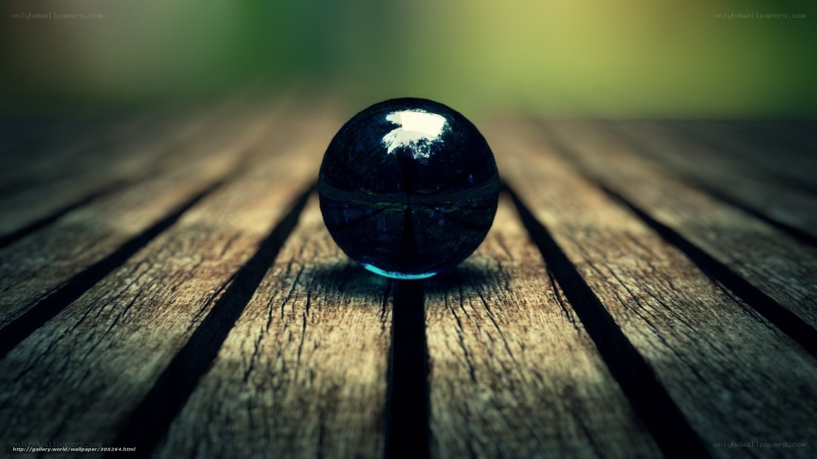 Blue marble on wooden surface