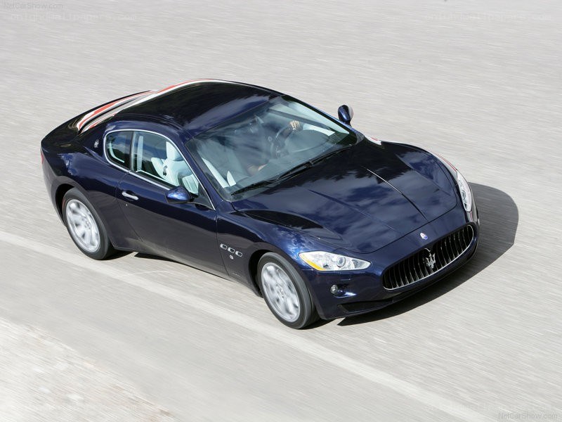 blue maserati coupe in motion