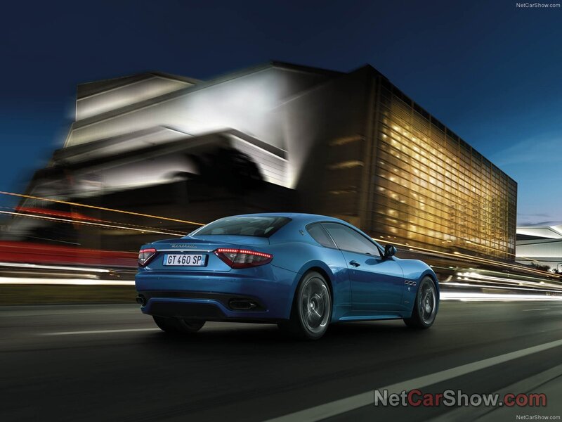 Blue Maserati GT in motion