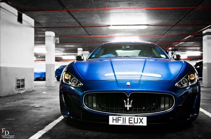 Blue Maserati in parking garage
