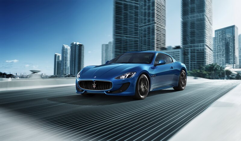 Blue Maserati on city road