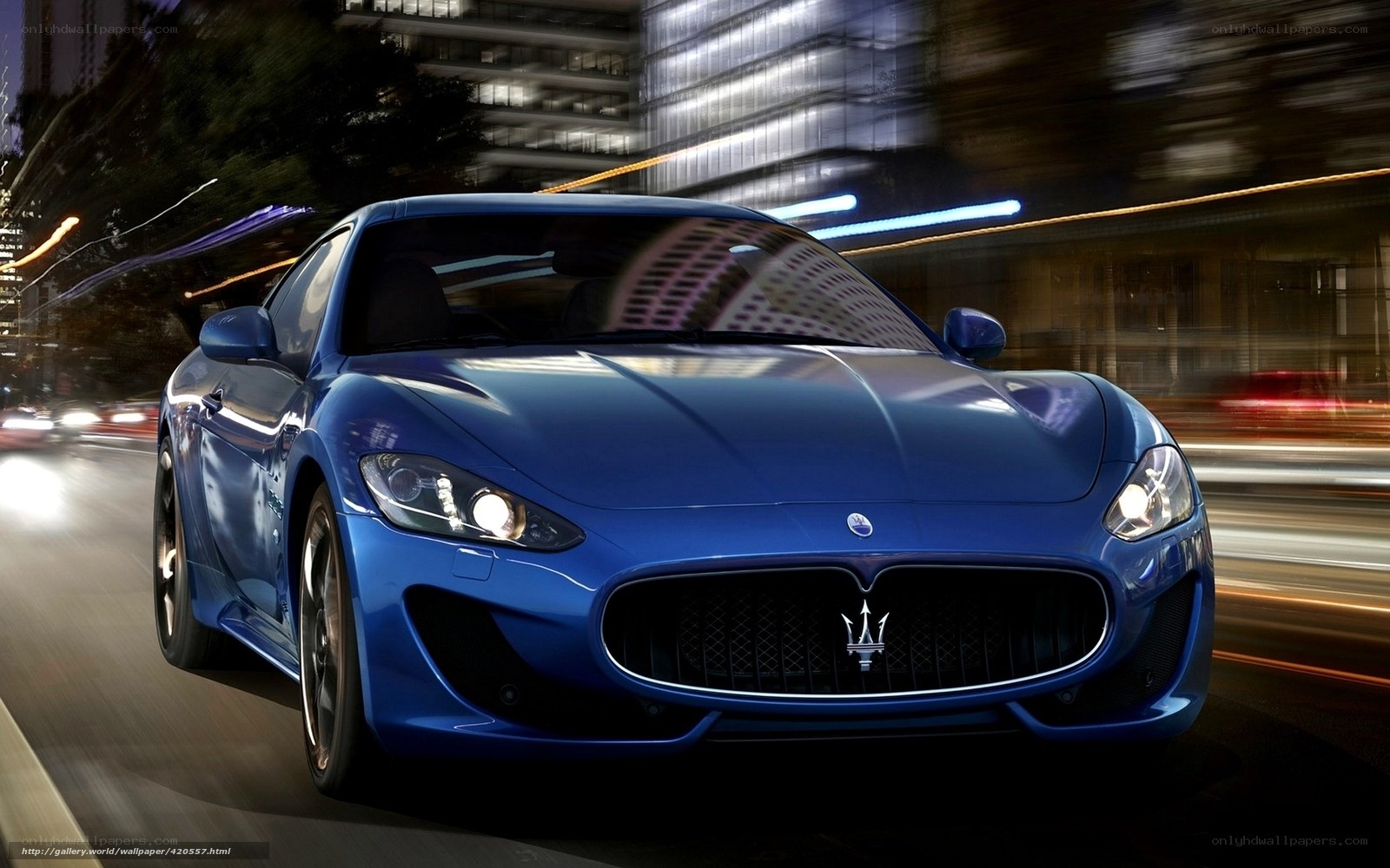 Blue Maserati sports car at night