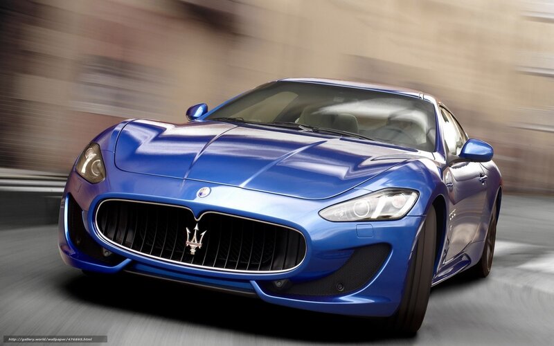 Blue Maserati sports car in motion