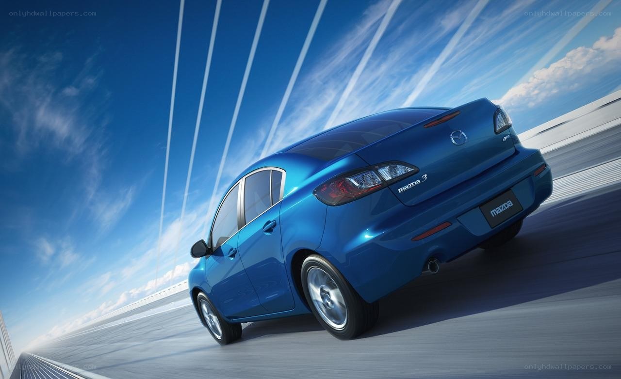 Blue Mazda 3 in motion