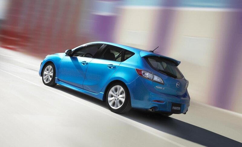 blue mazda 3 in motion