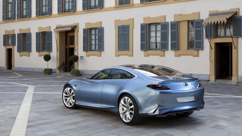 Blue Mazda concept car in courtyard