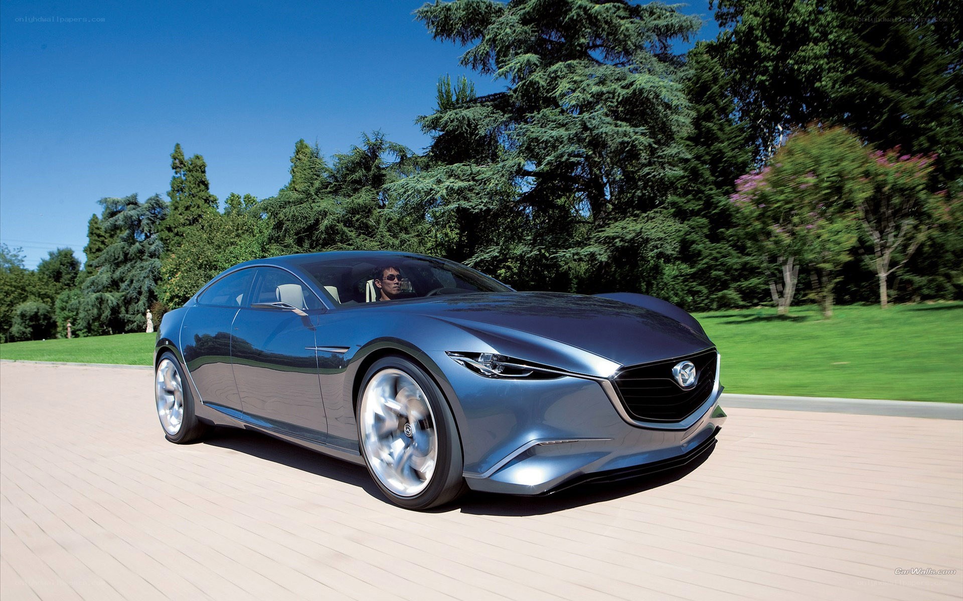 Blue Mazda concept car on road