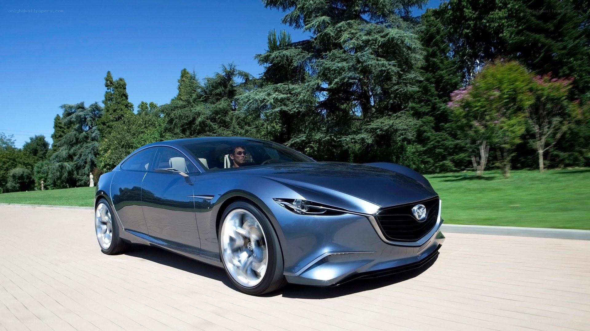 Blue Mazda concept car on road