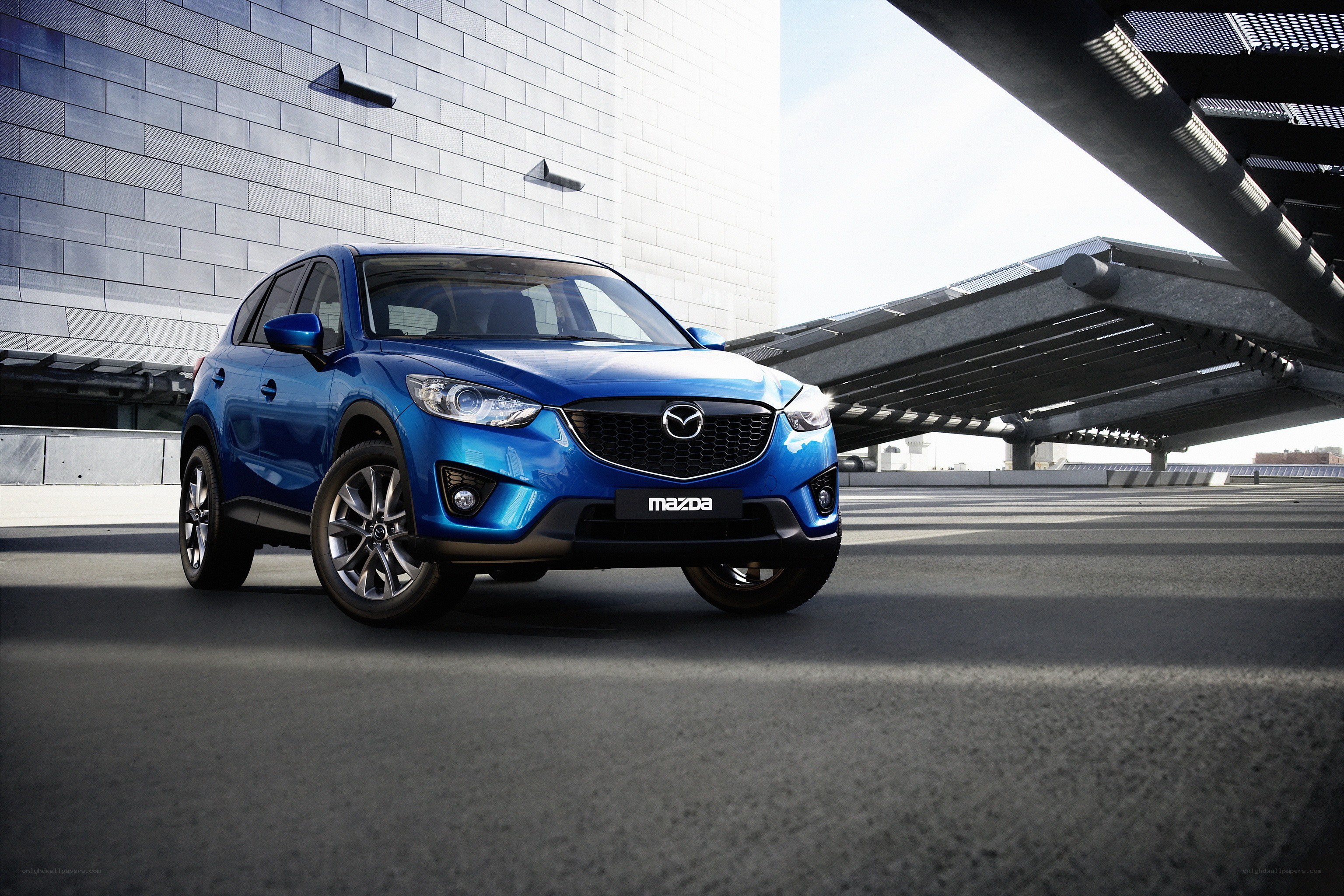 Blue Mazda CX-5 in urban setting