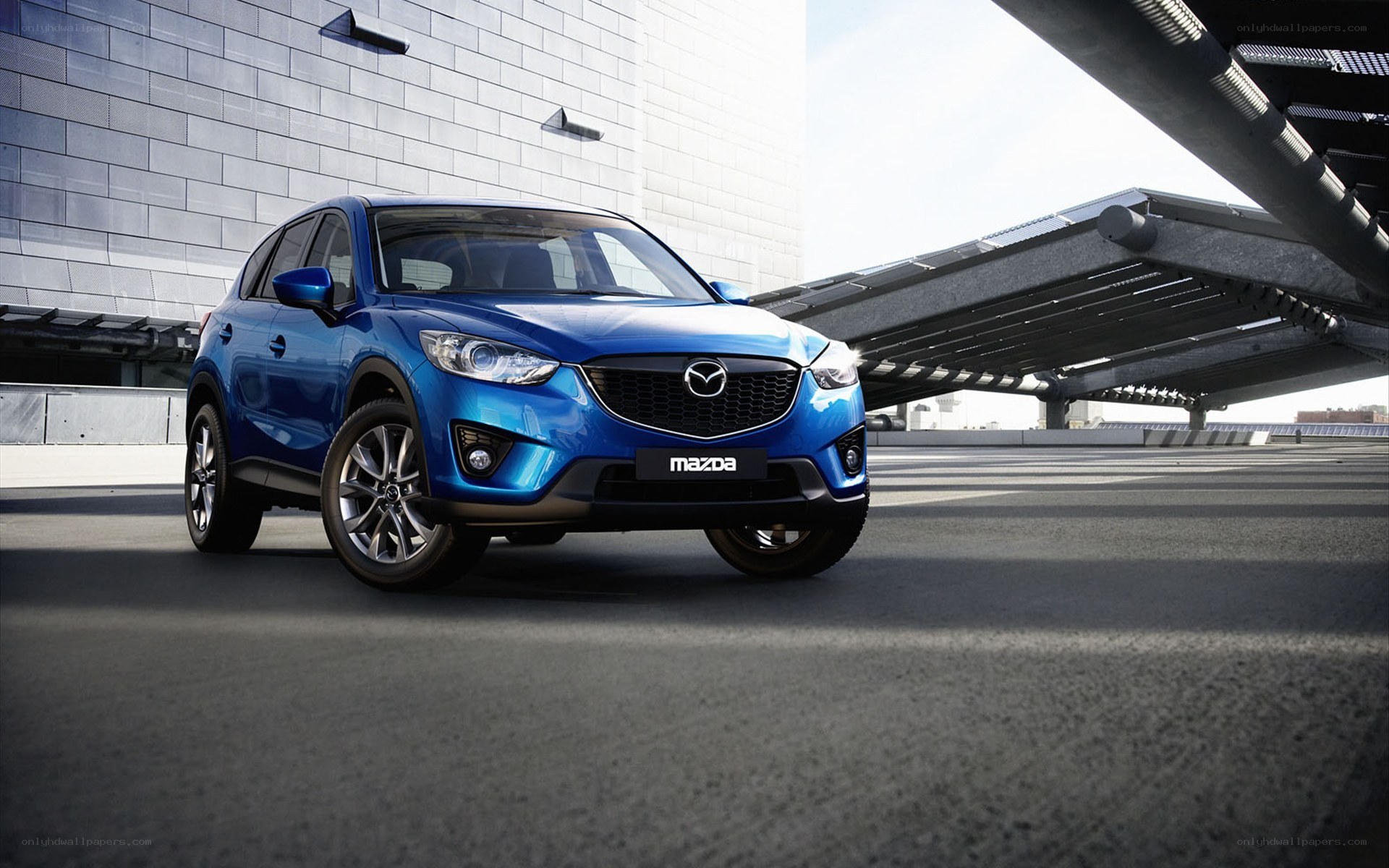 Blue Mazda CX-5 in urban setting