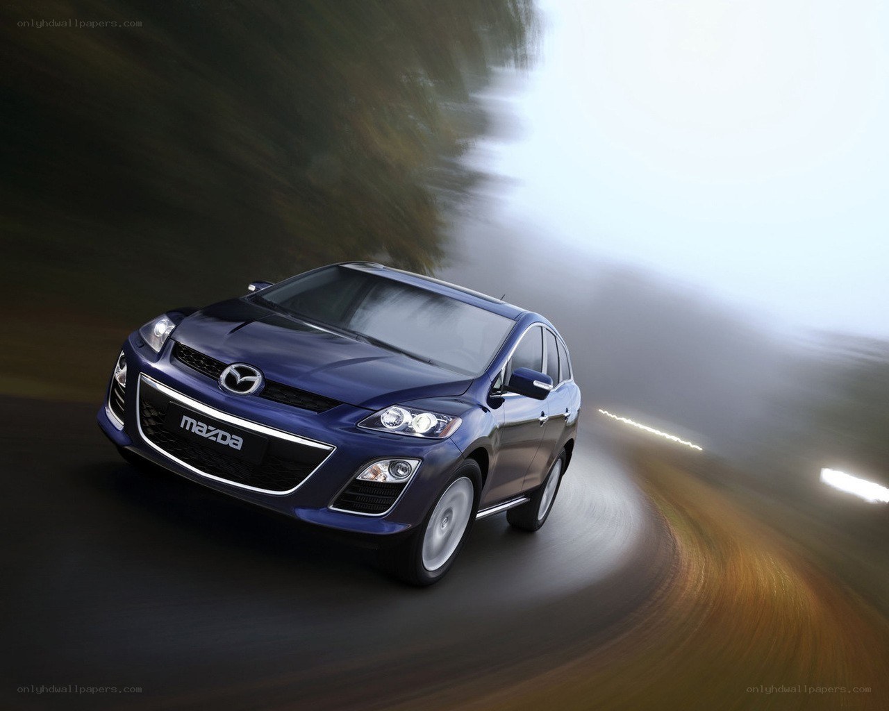 Blue Mazda CX-7 in motion