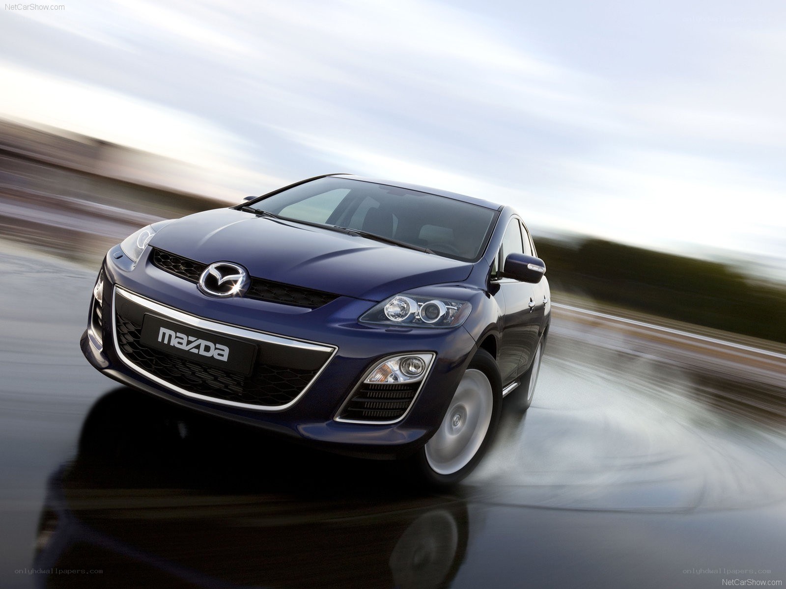 Blue Mazda CX-7 in motion