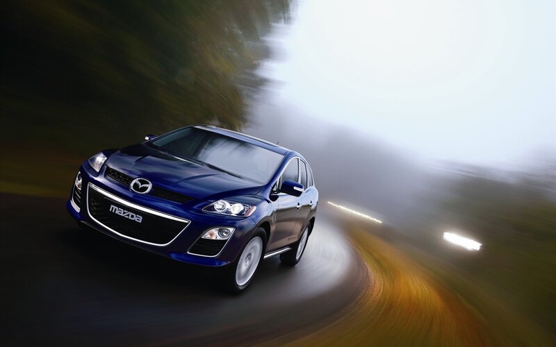 Blue Mazda CX-7 in motion