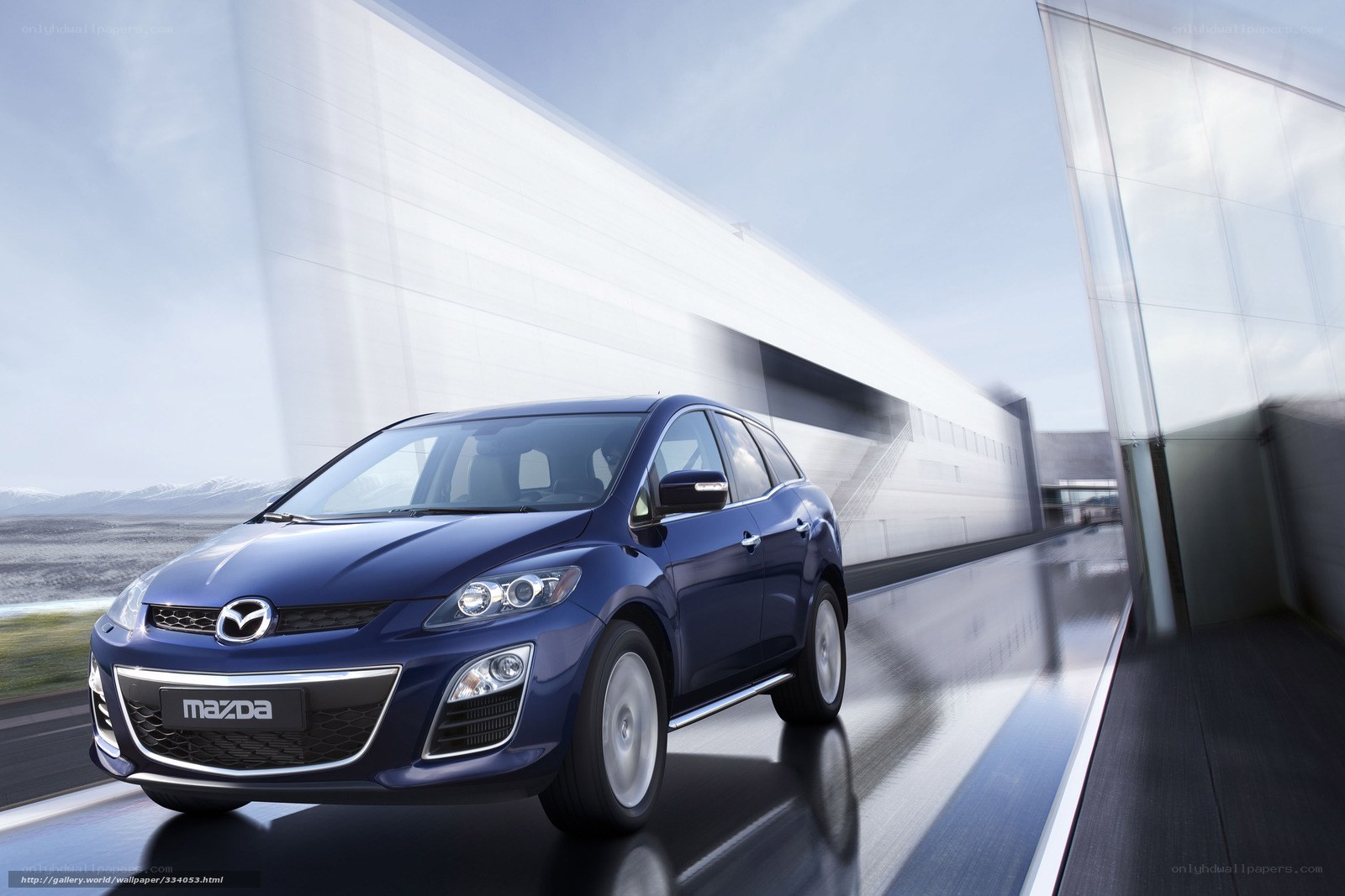 Blue Mazda CX-7 in motion