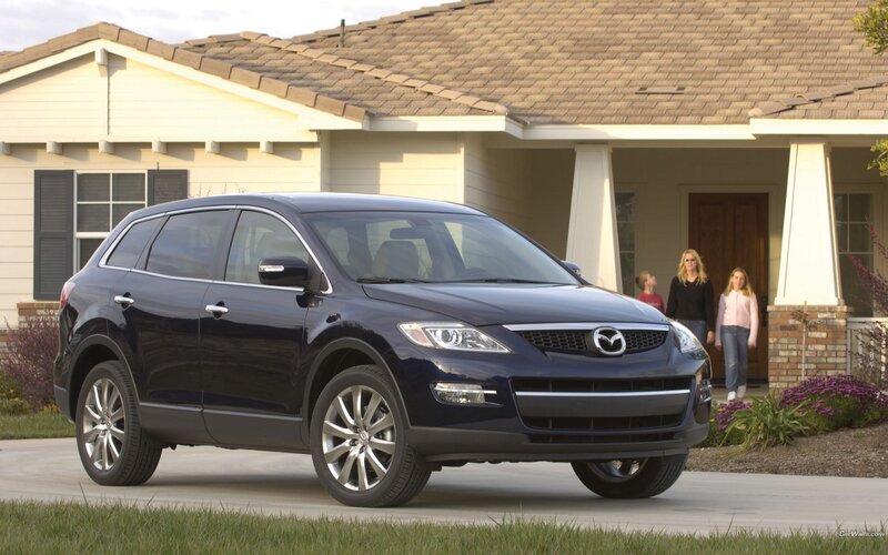 Blue Mazda CX-9 in front of house