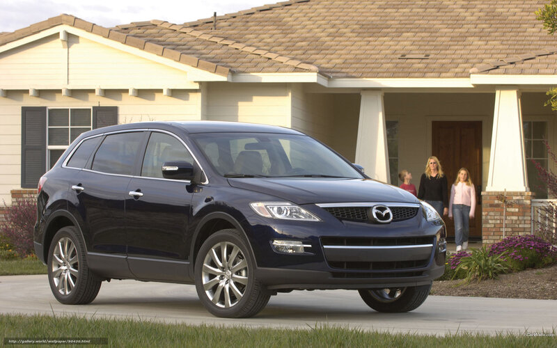 Blue Mazda CX-9 in front of house