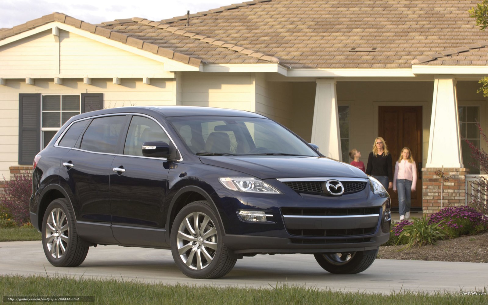 Blue Mazda CX-9 in front of house