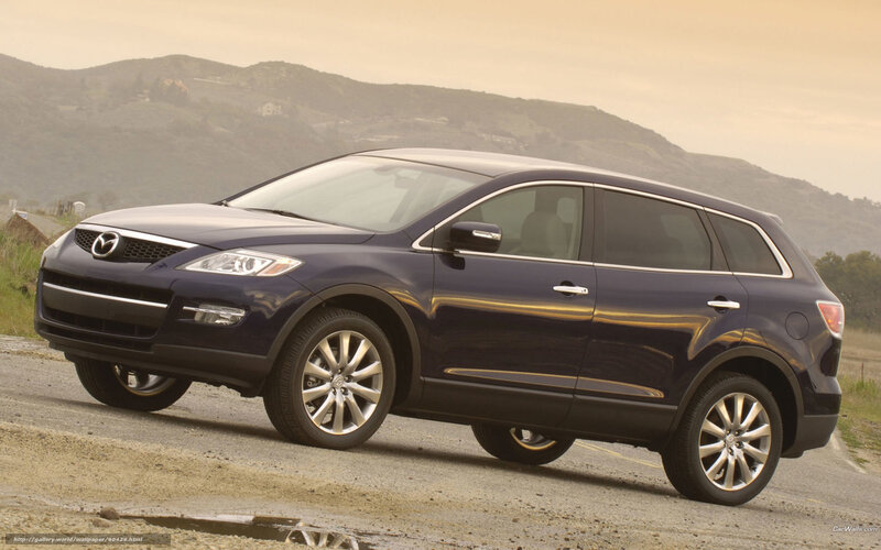 Blue Mazda CX-9 on a road