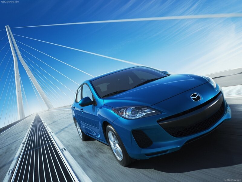 Blue Mazda Hatchback — Dynamic
