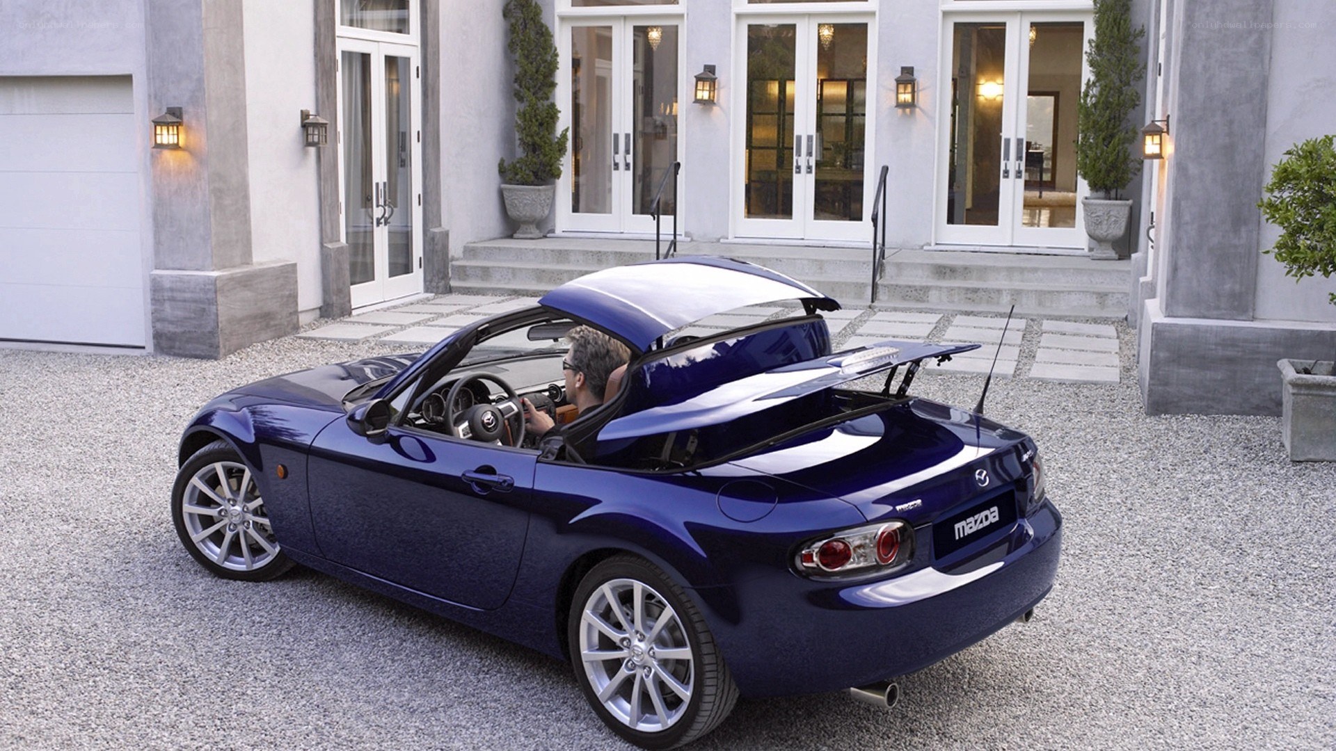 Blue Mazda Miata convertible