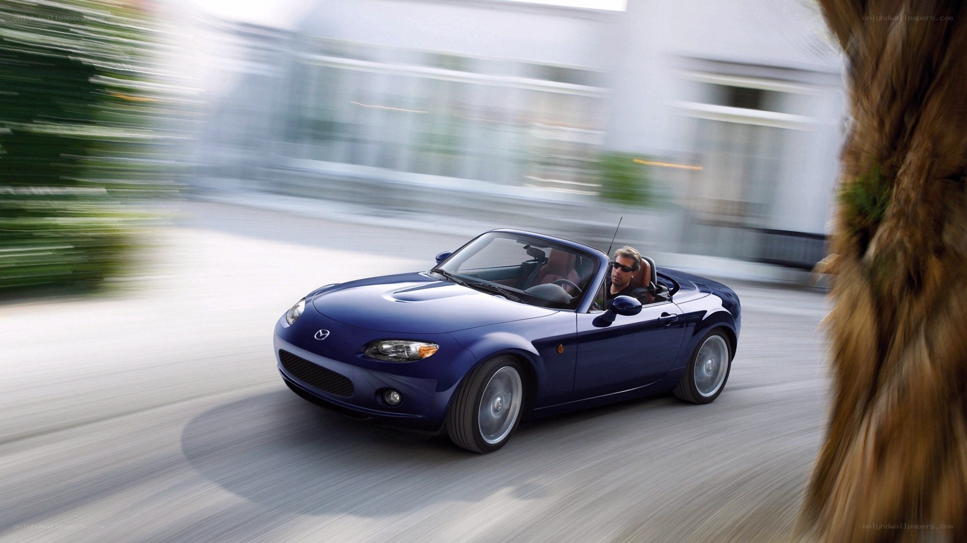 blue mazda miata convertible