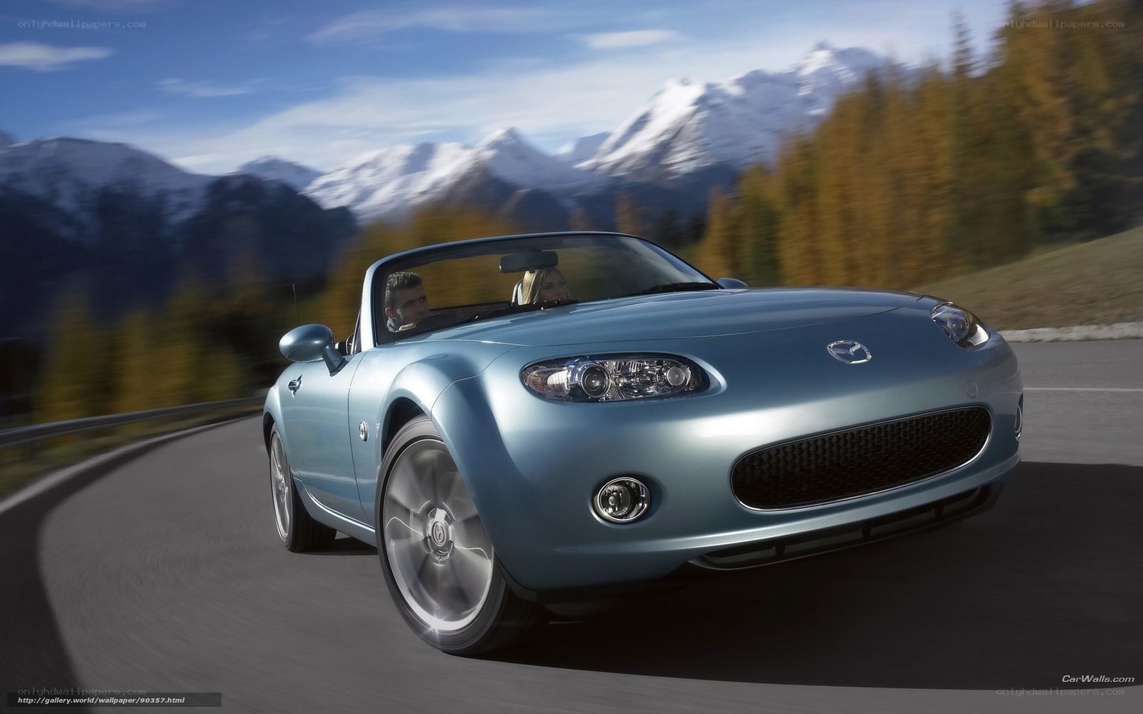 Blue Mazda Miata on mountain road