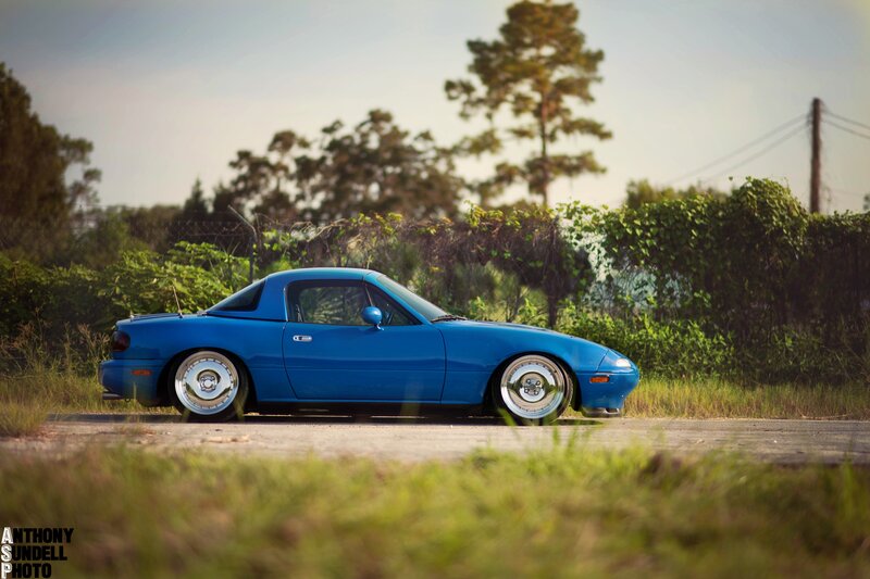 blue mazda miata sports car