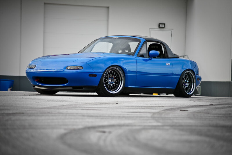blue mazda miata sports car