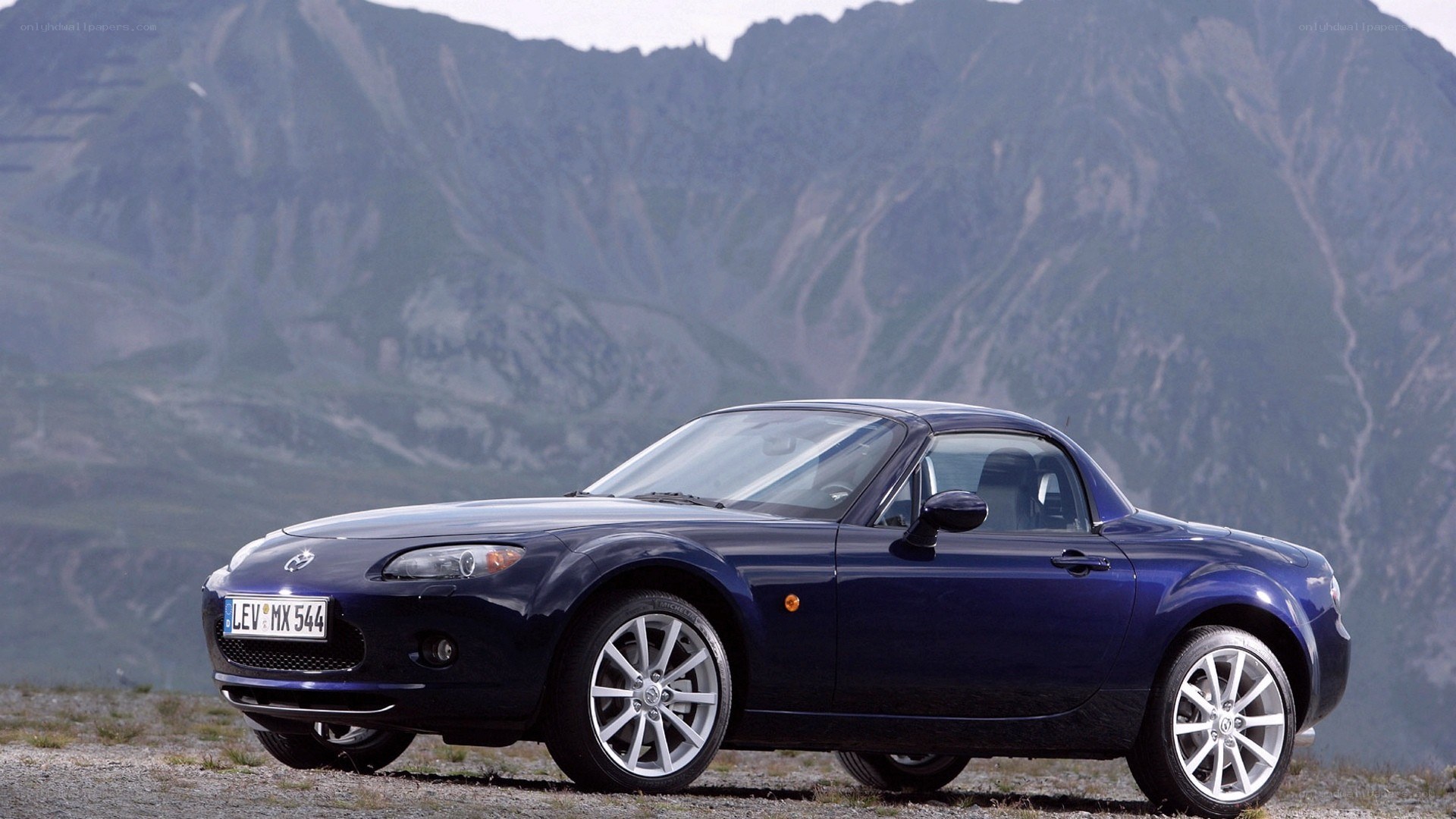 Blue Mazda MX-5 in mountain setting