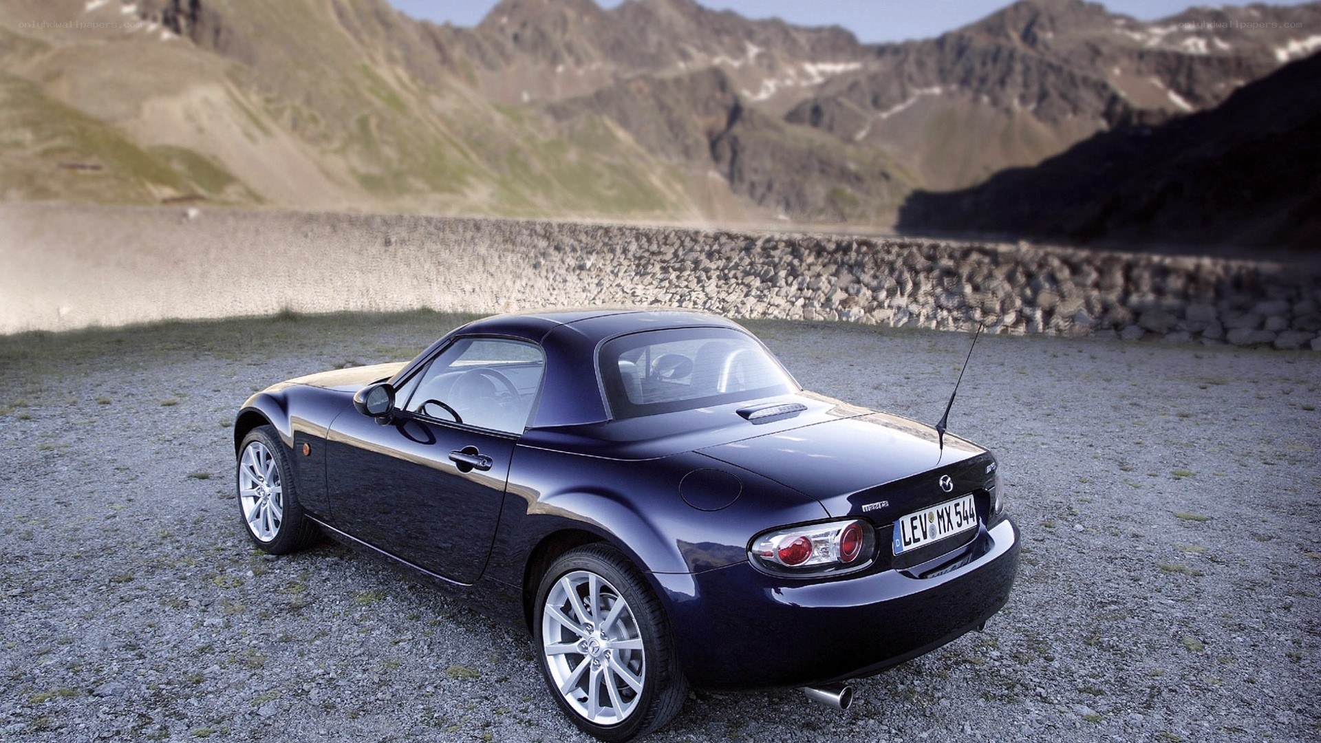 Blue Mazda MX-5 in mountain setting
