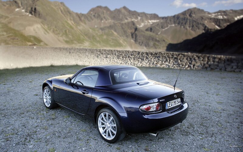 Blue Mazda MX-5 in mountain setting