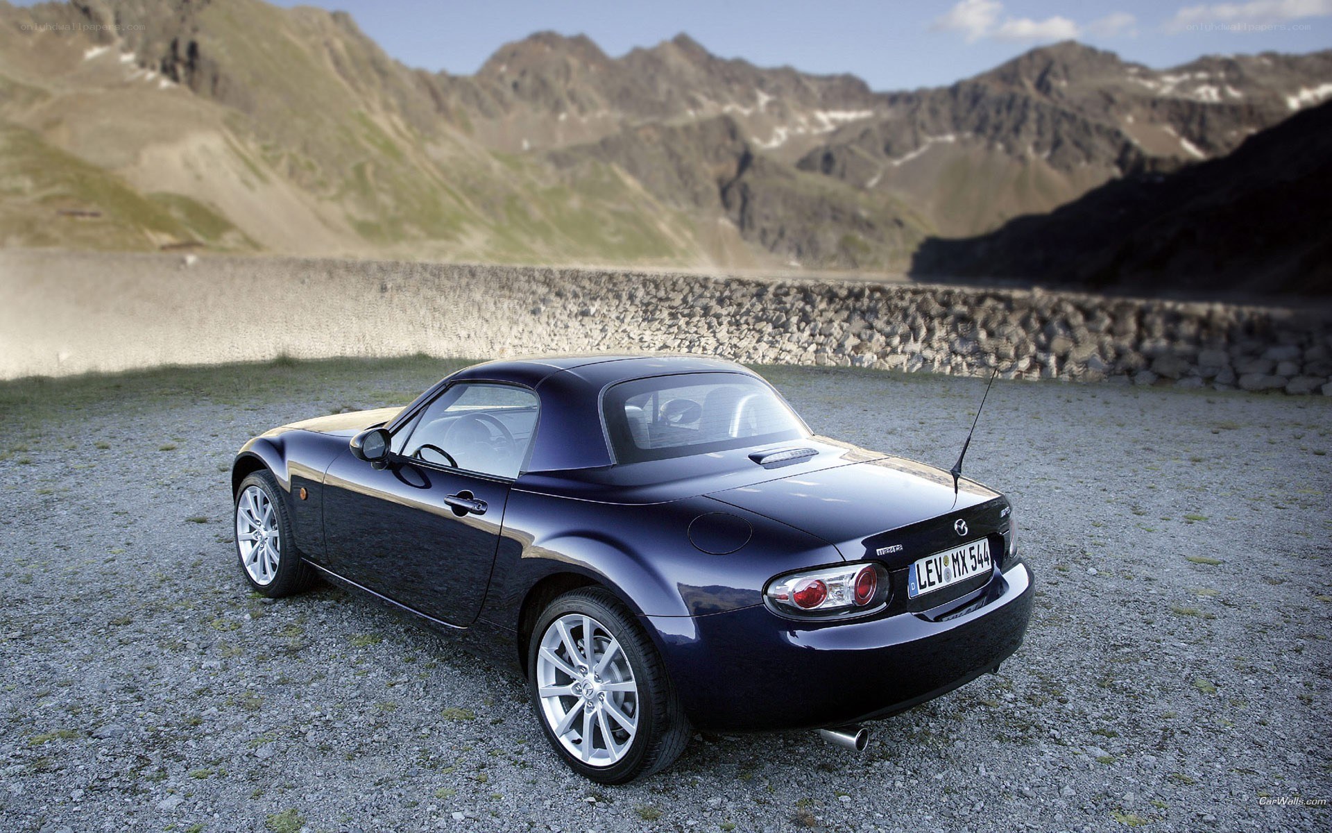 Blue Mazda MX-5 in mountain setting