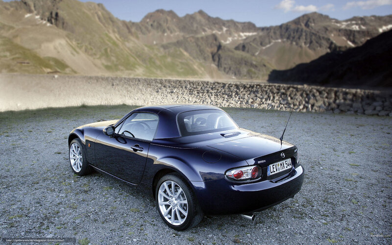 Blue Mazda MX-5 in mountain setting