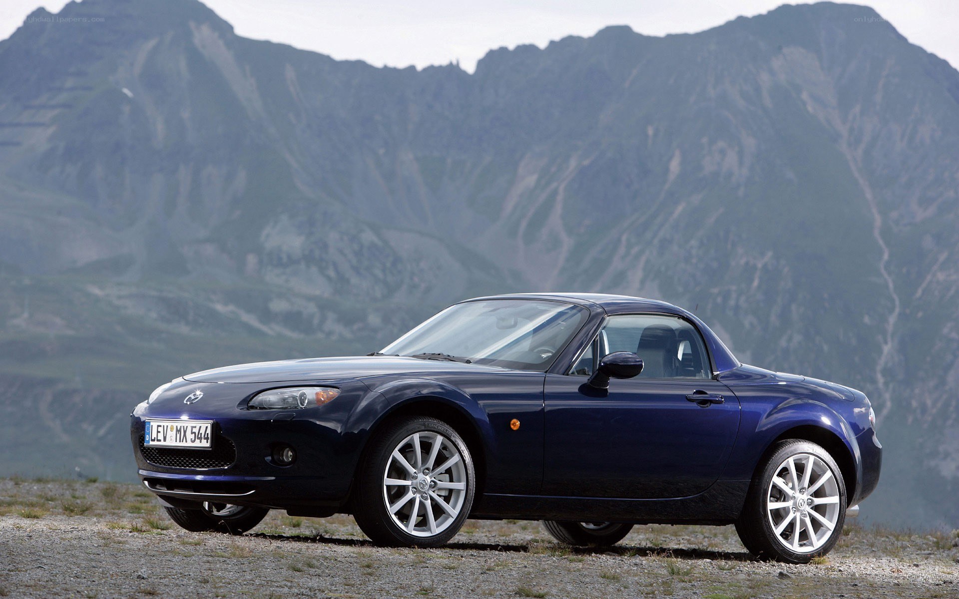 Blue Mazda MX-5 in mountains