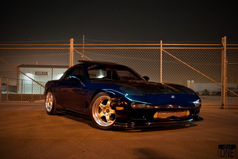 blue mazda rx-7 at night