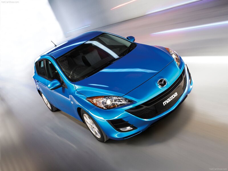 Blue Mazda3 in motion