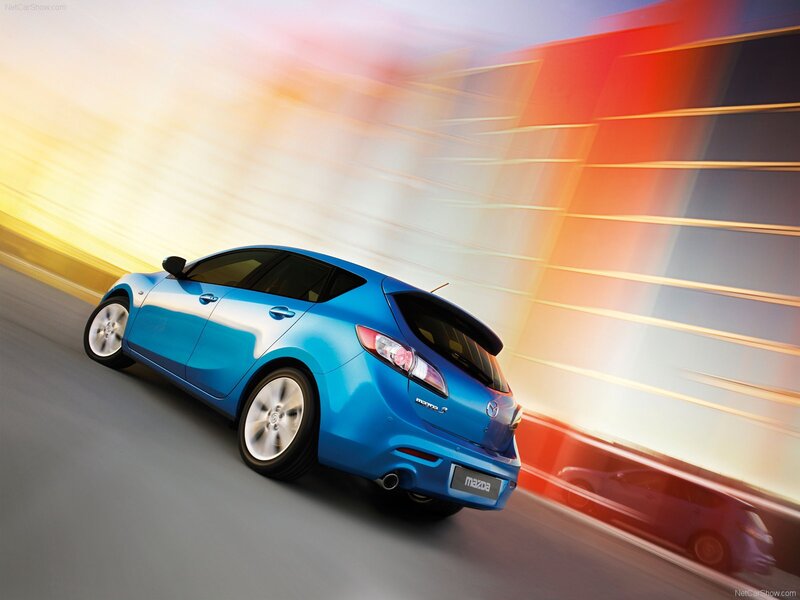Blue Mazda3 in motion