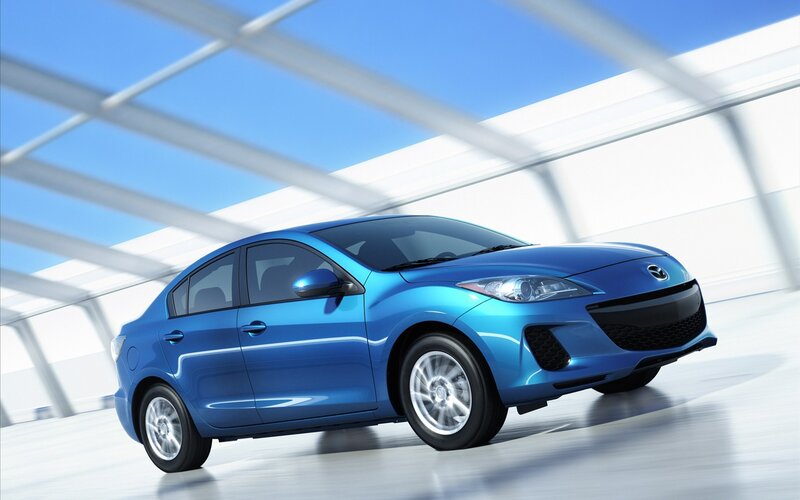 Blue Mazda3 sedan in motion