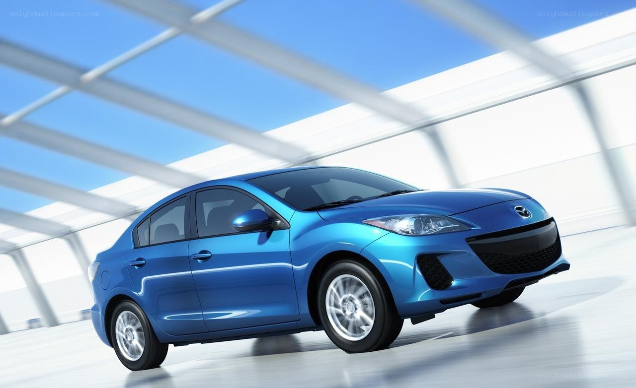 Blue Mazda3 sedan in motion