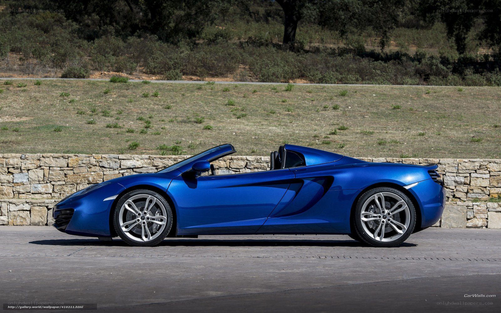 blue mclaren convertible sports car