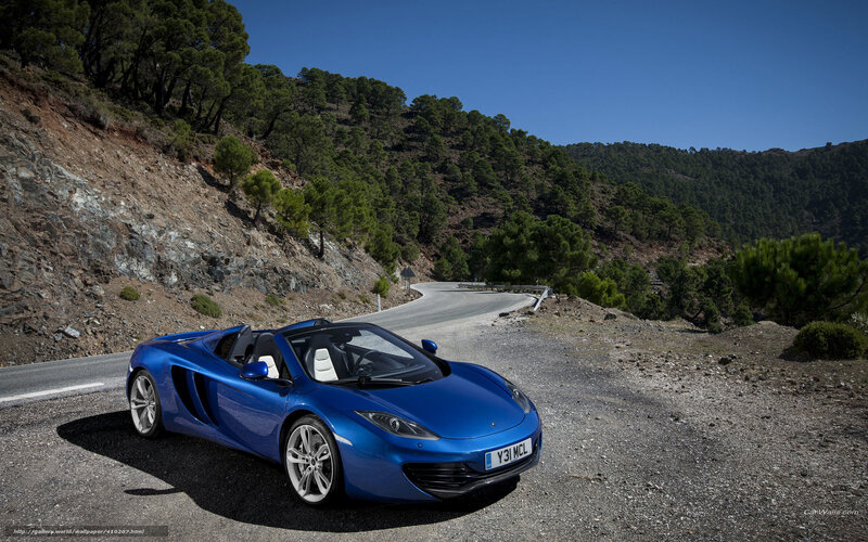 Blue McLaren on a mountain road