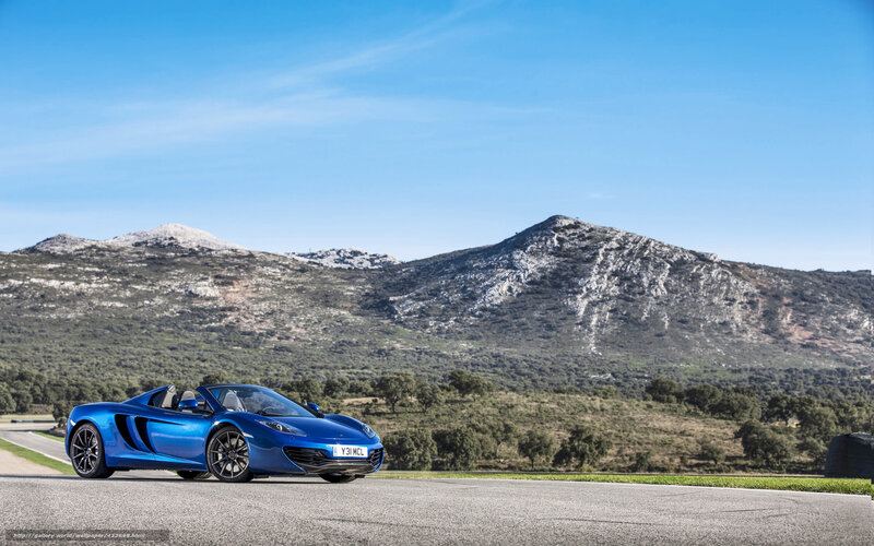 Blue McLaren on a mountain road