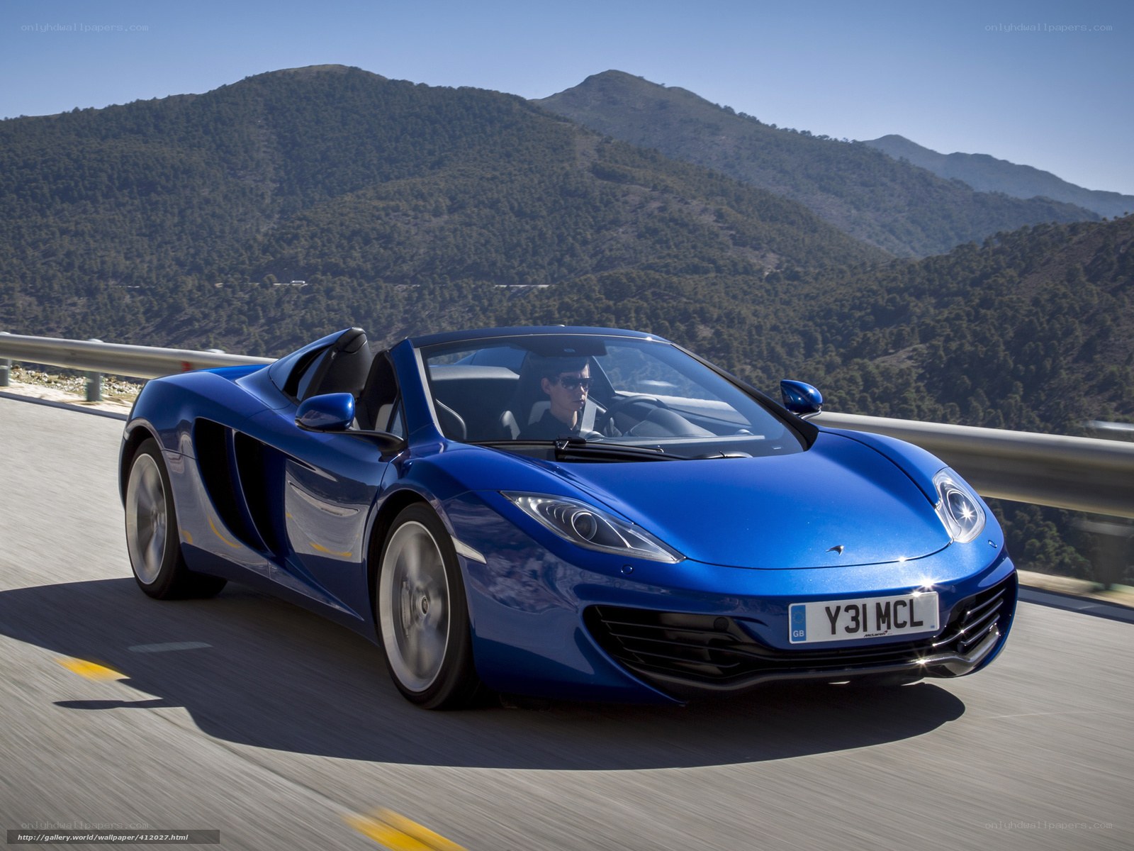 Blue McLaren on mountain road