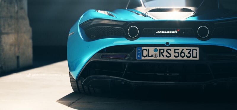 Blue McLaren Sports Car — Dramatic