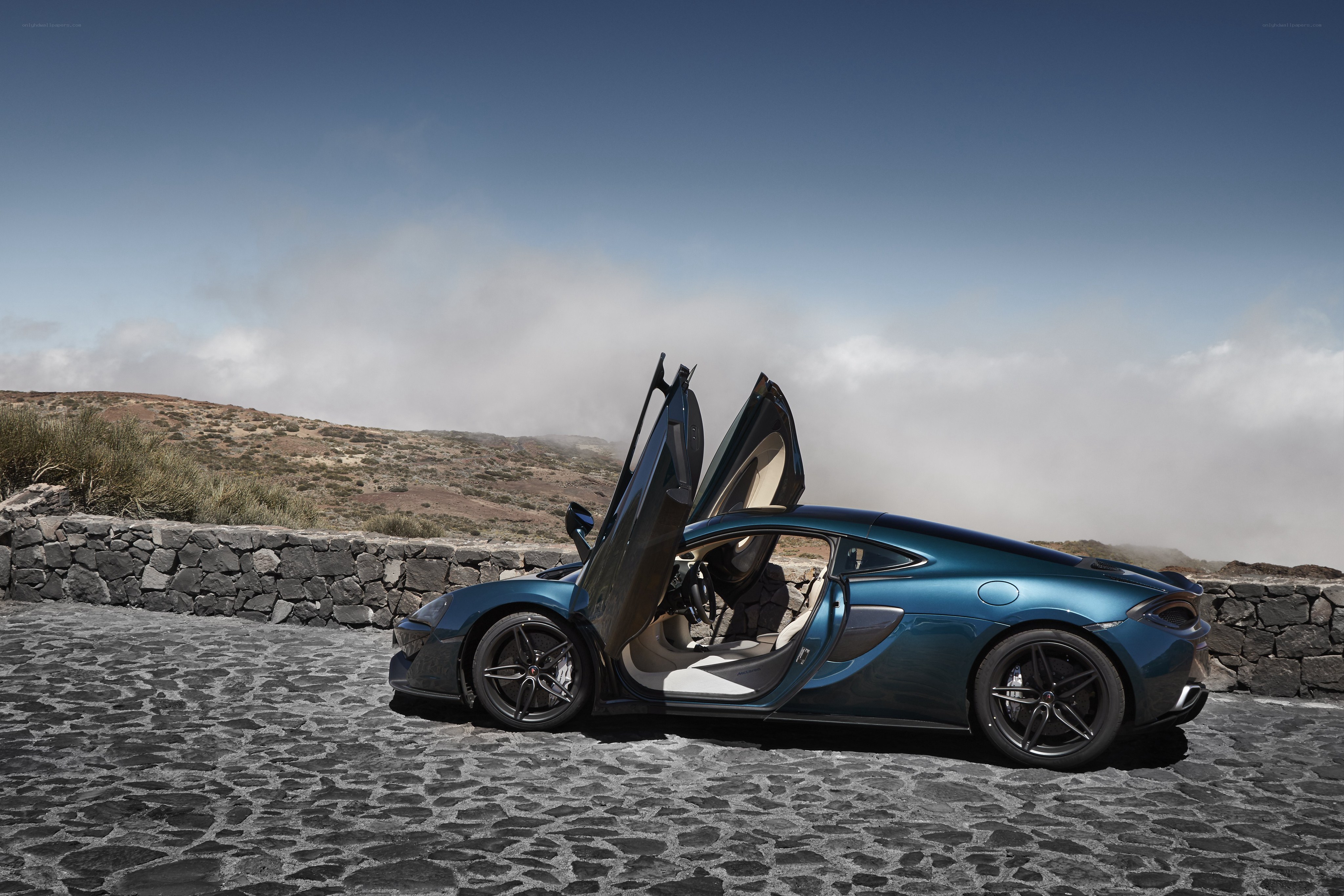 Blue McLaren with doors open