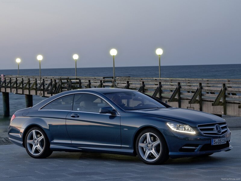 Blue Mercedes-Benz CL500 parked by pier