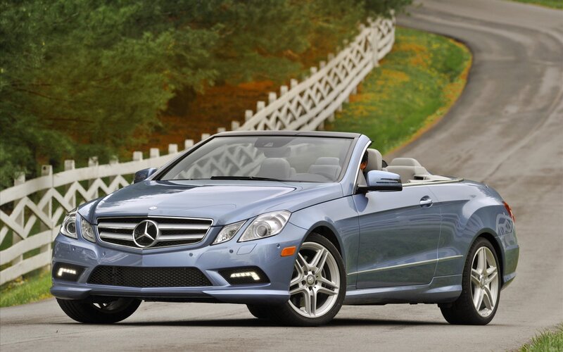 Blue Mercedes-Benz convertible on a country road