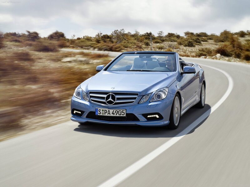 Blue Mercedes-Benz convertible on road